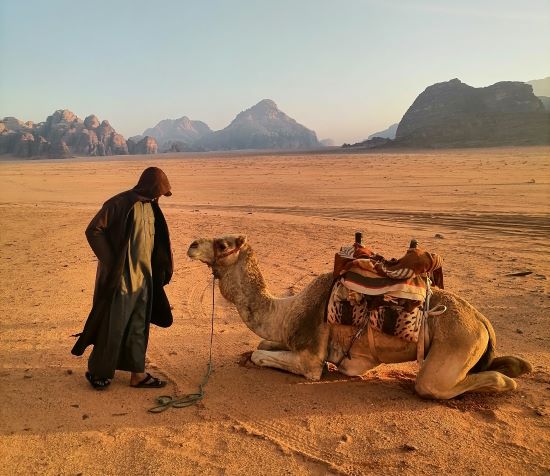 Hussein with his camel in Wadi Rum